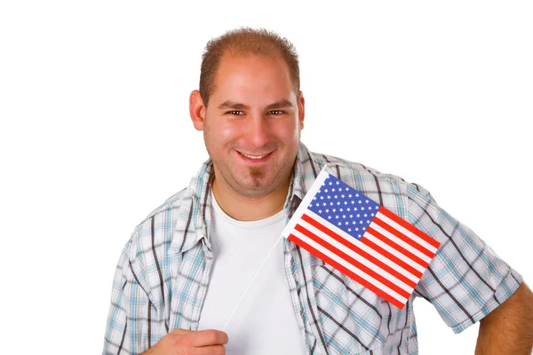 stock image Young man holding American flag