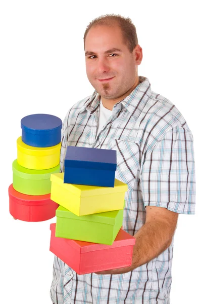Renkli hediye kutuları ile genç adam — Stok fotoğraf