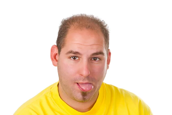 Young man with put out a tongue — Stockfoto