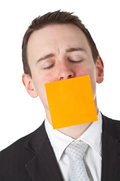 Επιχειρηματίας με μια κενή σημείωση αυτοκόλλητο πάνω από το στόμα — Φωτογραφία Αρχείου