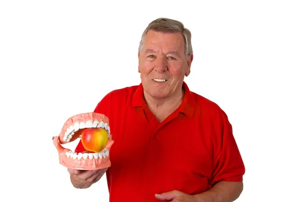 Starszy mężczyzna z modell zębów — Zdjęcie stockowe
