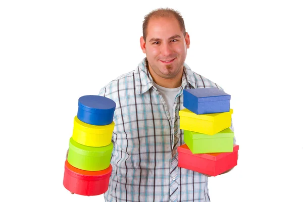 Young man with colorful gift boxes — Stock Photo, Image
