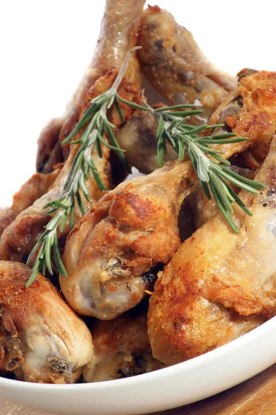 Grilled chicken legs with rosemary in a white bowl — Stock Photo, Image