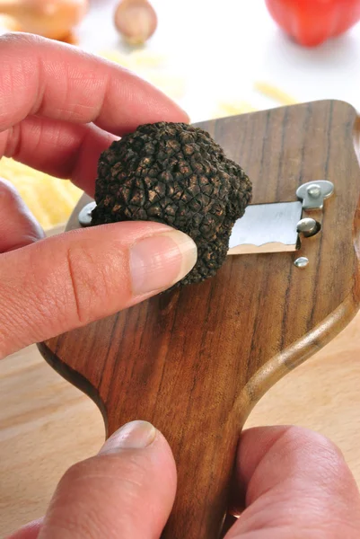 Summer truffle is prepared with a truffle slicer — Stock Photo, Image