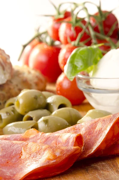 Mediterranean breakfast with salami, olives and tomato — Stock Photo, Image