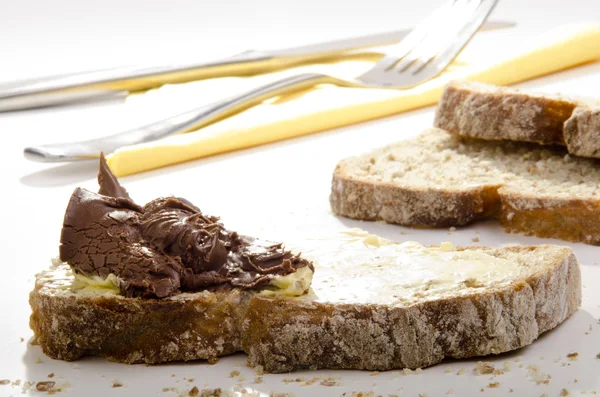 Home made bread spread with nougat cream — Stock Photo, Image