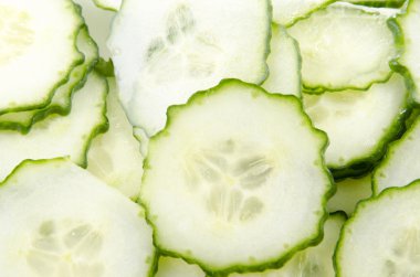 An organic cucumber cut into thin slices