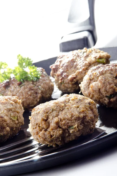 Freshly fried meat balls lying on a pan — Stock Photo, Image