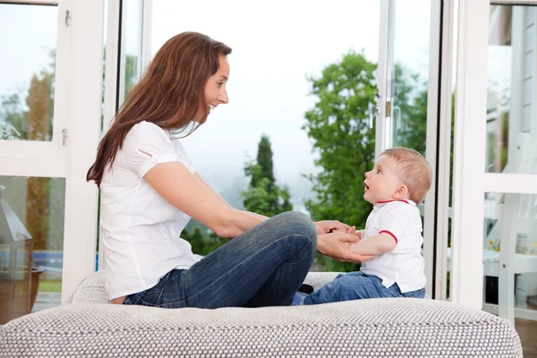Mother sitting with her child — Stock Photo, Image