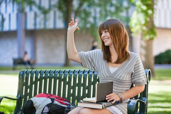 College girl waving hand — Stock Photo, Image