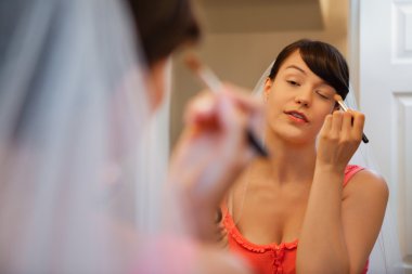 Bride Putting on Eye Make-Up clipart