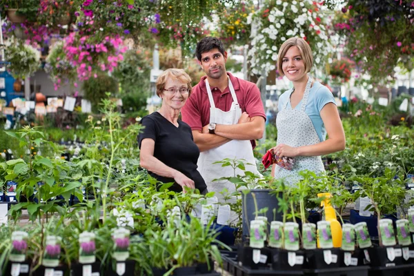 Florists with female customer — Stock Photo, Image