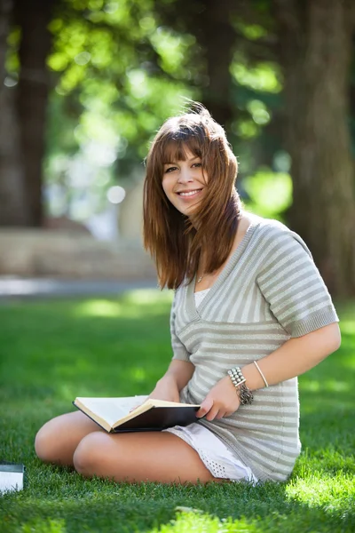 College student holding book — Stock Photo, Image