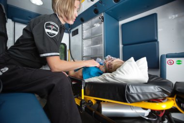 Ambulance Interior with Senior Woman clipart