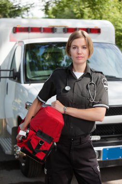 EMS Professional Woman with Oxygen Unit clipart