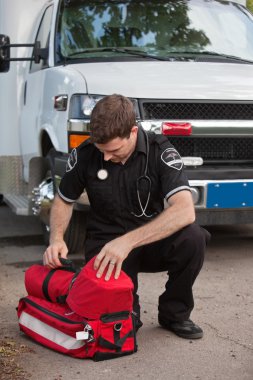 Male Paramedic with Oxygen Unit clipart