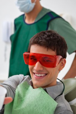 Patient at dentistal clinic clipart