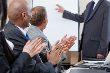 Business applauding during presentation clipart