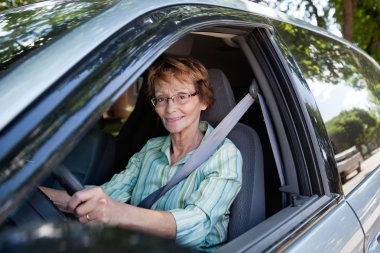 Senior woman driving car clipart