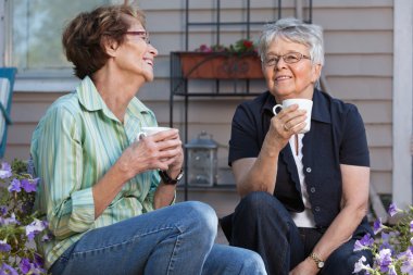 Women having cup of tea clipart