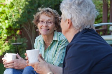 Senior Women with Warm Drinks clipart