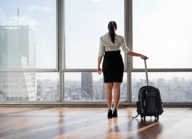 Businesswoman With Luggage Trolley clipart