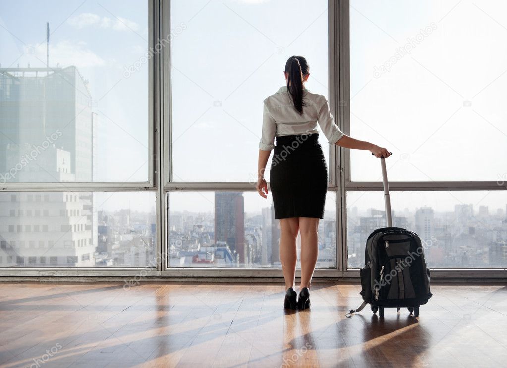Businesswoman With Luggage Trolley