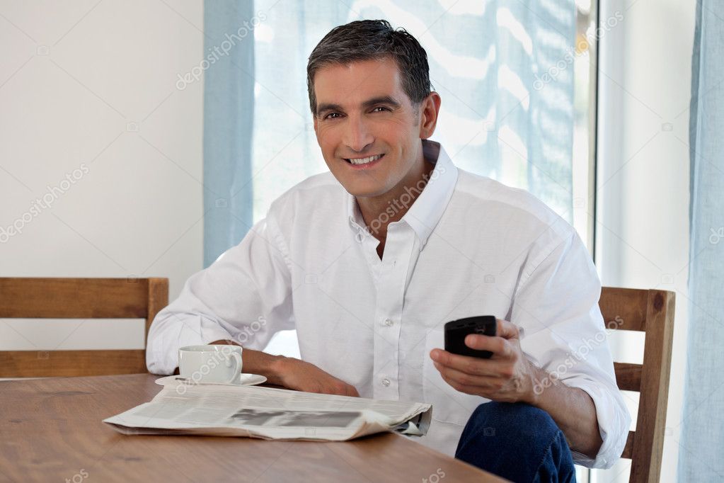 Middle Aged Man Holding Cell Phone