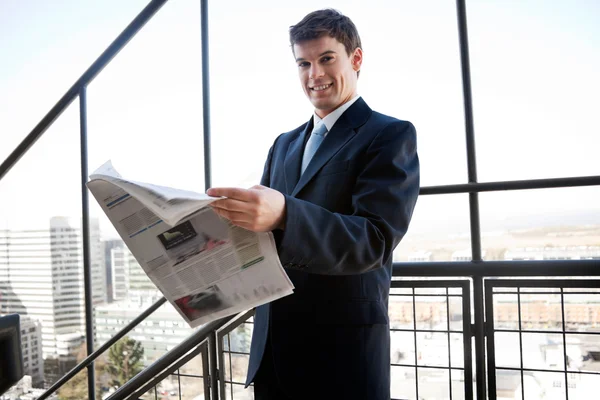 Businessman Holding Newspaper — Stock Photo, Image
