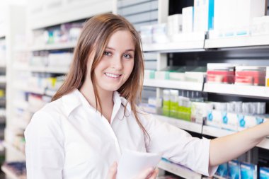 Pharmacist Working in Pharmacy Drugstore clipart