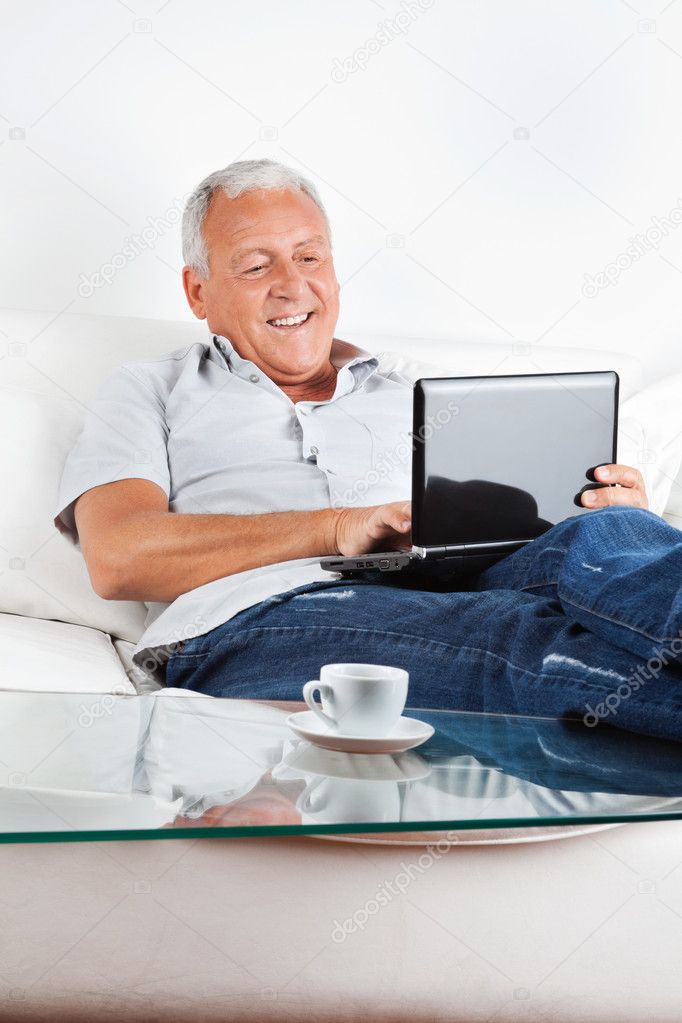 Relaxed Senior Man Working on Laptop