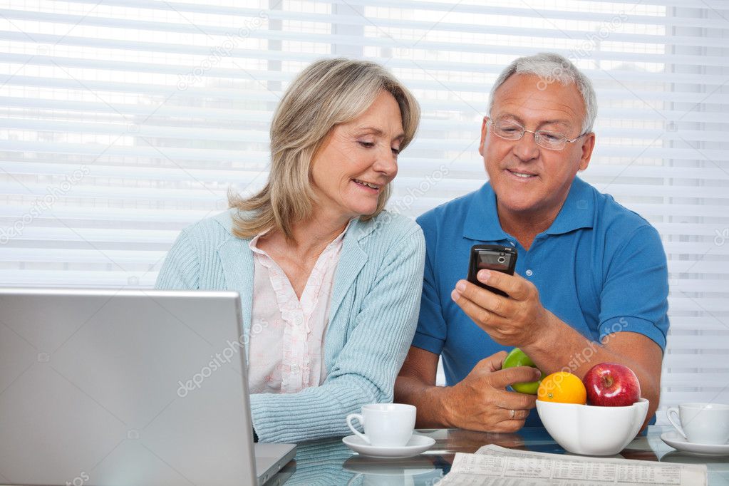 Man Showing Phone to his Wife