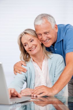 Couple Using Laptop clipart