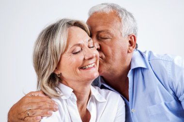 Husband Kissing Wife on Cheek clipart