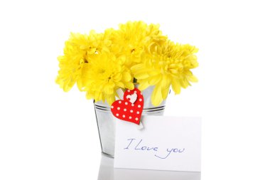 Yellow chrysanthemums in a pail clipart