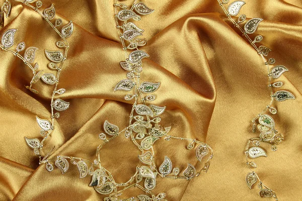 Háttérben az arany ruhába — Stock Fotó