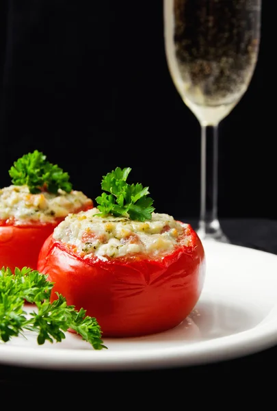 Tomatoes stuffed with cheese and decorated with fresh herbs — Stock Photo, Image