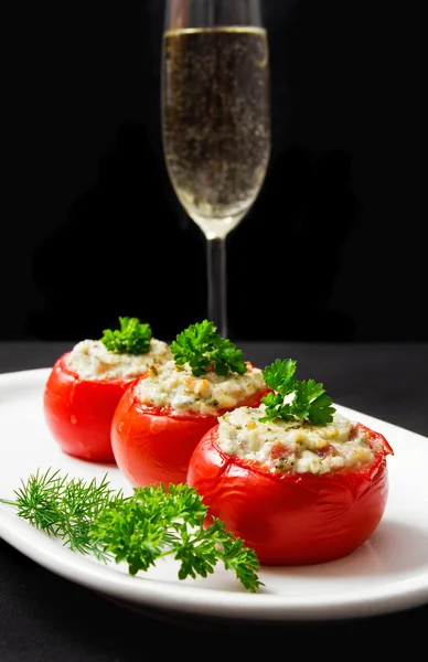 Tomatoes stuffed with cheese and decorated with fresh herbs — Stock Photo, Image