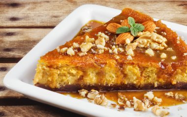 Pumpkin cheesecake with almonds and walnuts clipart