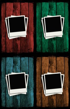 Polaroids over colorful grunge wooden walls clipart