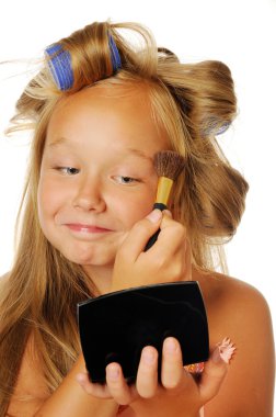 Beautyful girl with curlers putting makup clipart