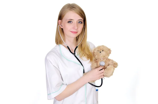 Pediatrician examining a teddy bear — Stock Photo, Image