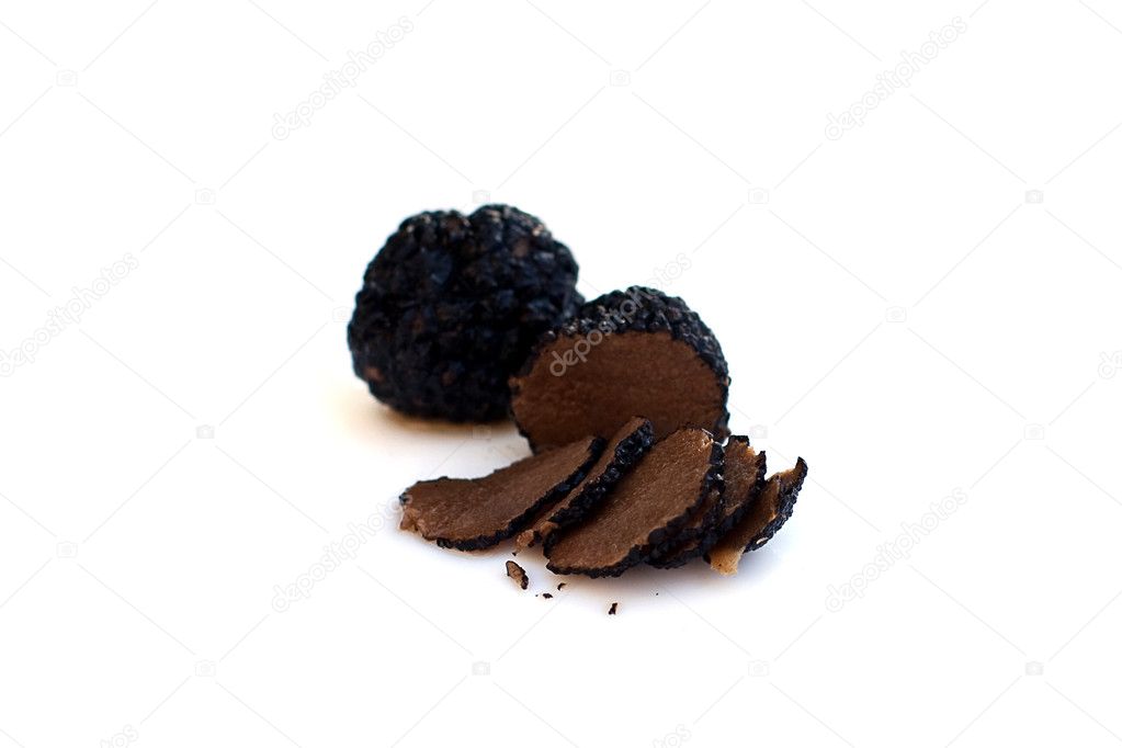 Black truffles isolated on white (shallow depth of field)