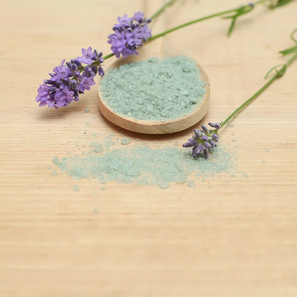 Bath salt and flowers on wooden background — Stock Photo, Image