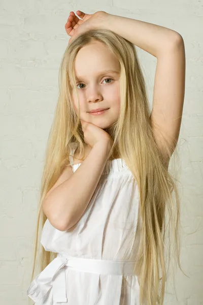 Smiling blonde girl with long hair — Stock Photo, Image