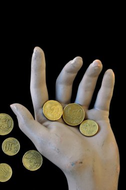 Spare change worn hand holding money coins clipart