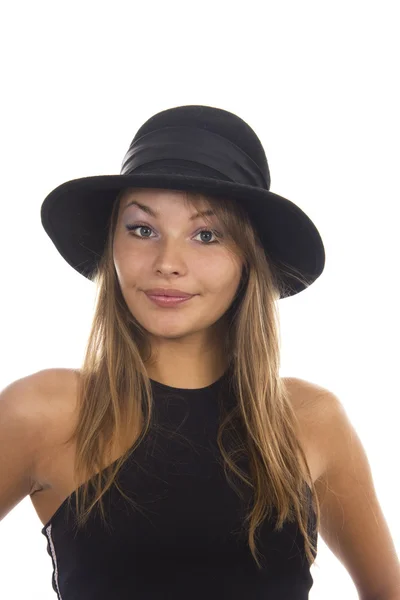Young woman in a black hat on a white background — Stock Photo, Image