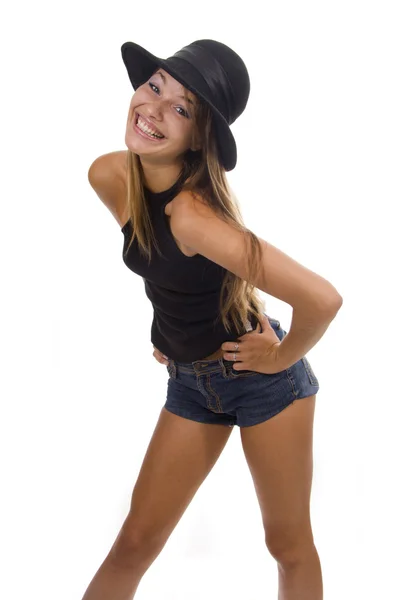 Mujer joven con sombrero negro sobre fondo blanco — Foto de Stock