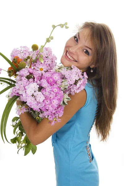 Beautiful girl holds a bunch of flowers, isolated — Stock Photo, Image