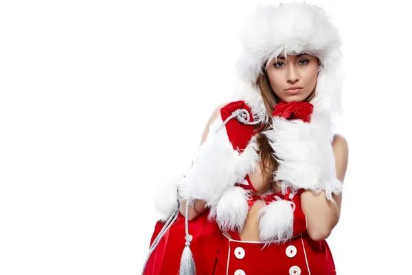 Studio porträtt av en sexig ung brunett kvinna klädd som santa — Stockfoto